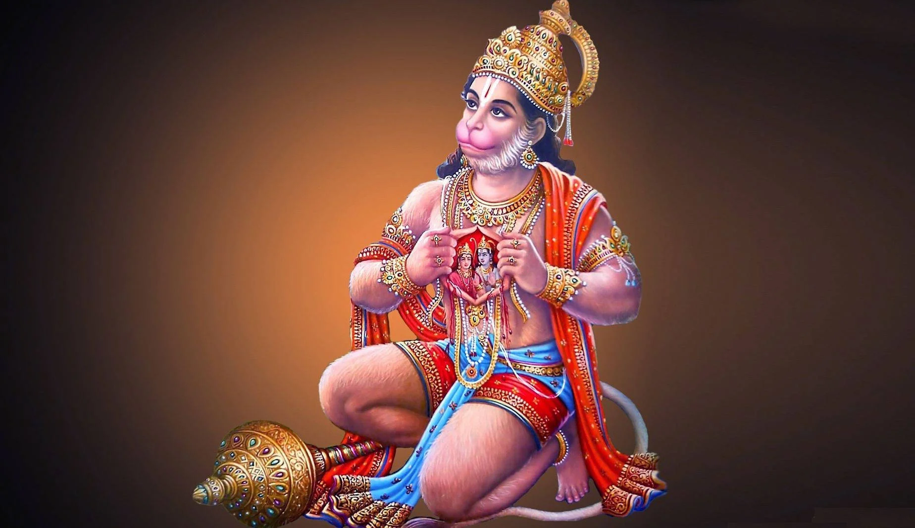 Hanuman quỳ bên chiếc chùy vàng trong trang phục nhiều màu sắc